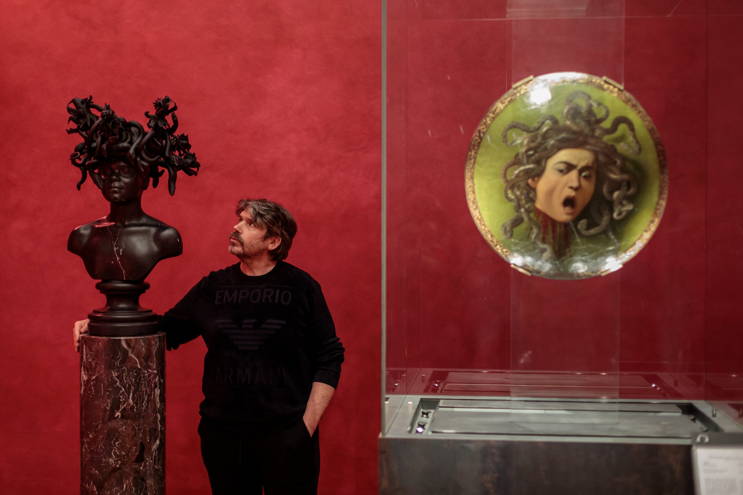 Koen Vanmechelen installing his artworks at the exhibition Seduzione, Gallerie degli Uffizi